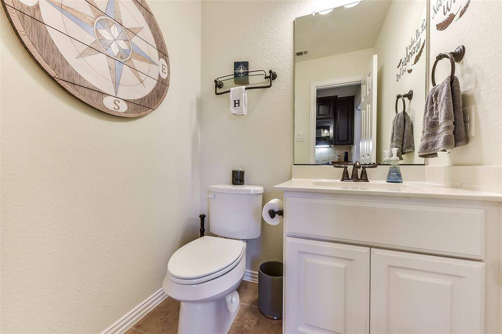Half bath between the game and media rooms.