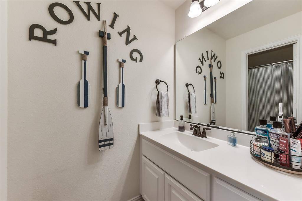 Private vanity with shared tub/shower combo.