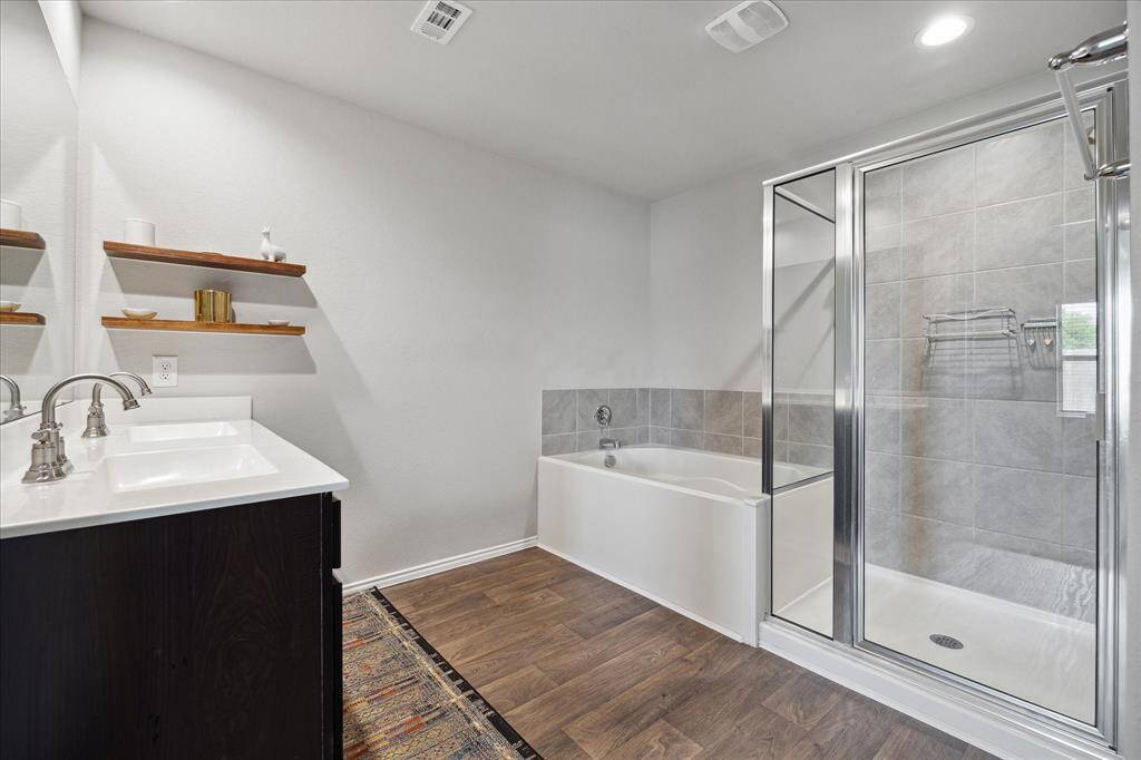 Primary bedroom with separate shower and large soaking tub!