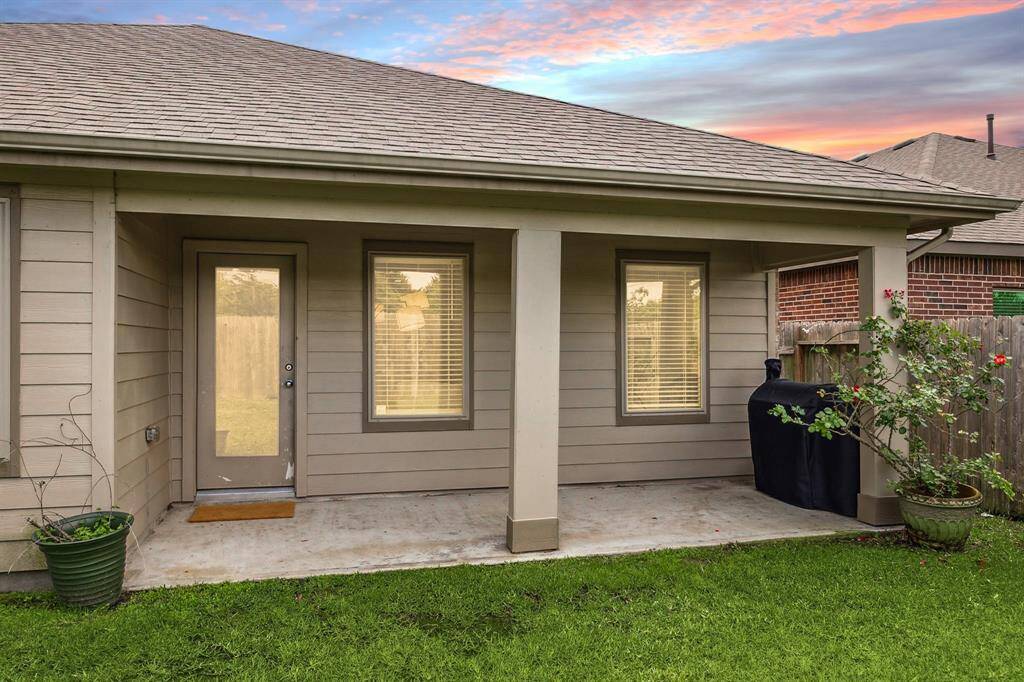 Large, covered back patio, overlooking the private, fenced backyard with no back neighbors!