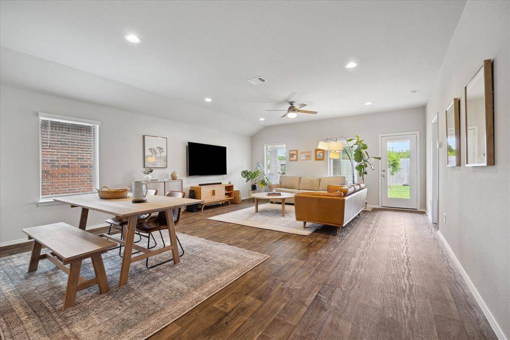 Spacious, open floor plan! This view is from the kitchen, overlooking the dining room, living room, and all the natural light in this home!
