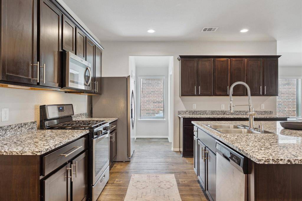 Large kitchen with tons of counter space, cabinets, a massive island!