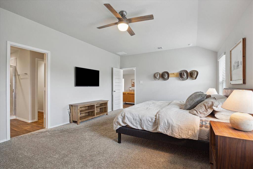 This primary bedroom has ample space and is so cozy!