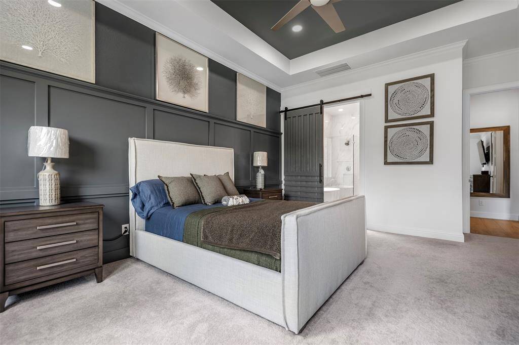 This serene primary bedroom blends comfort and sophistication making this space the perfect escape at the end of the day.