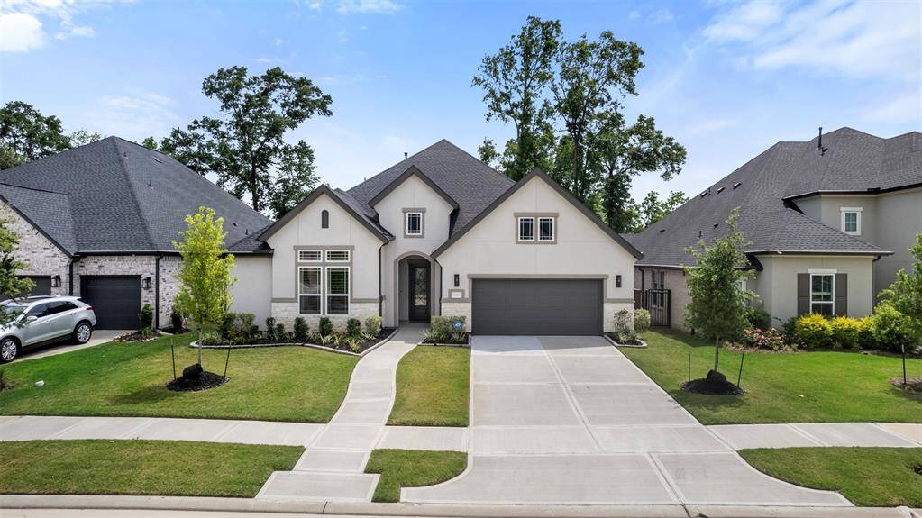 The front of the home features a welcoming sidewalk that leads to the entrance, complemented by a spacious double driveway offering plenty of parking. This thoughtful design ensures convenience and accessibility, while the clean lines and layout enhance the home’s curb appeal.