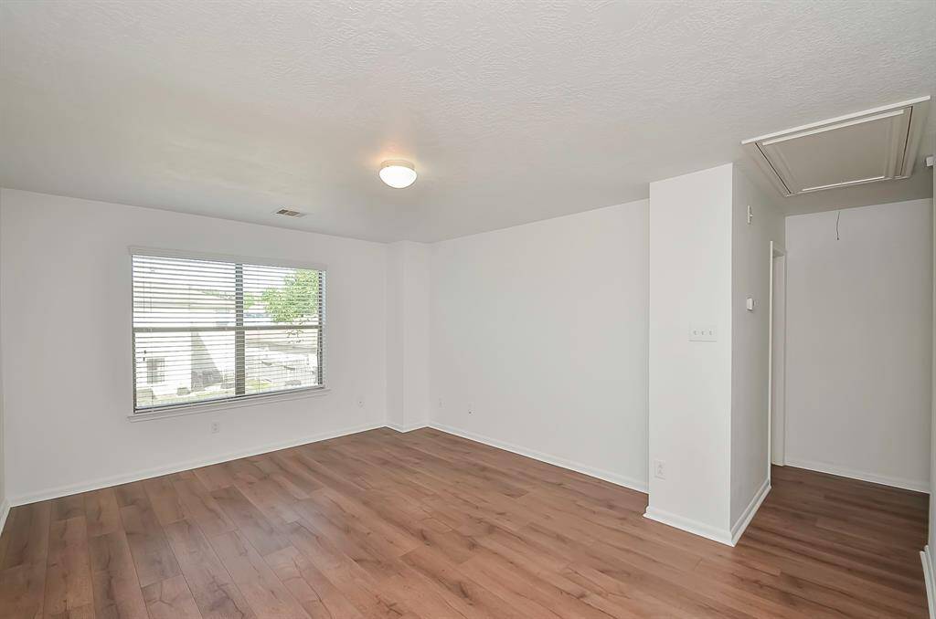 The game room offers front yard views. The hall lead to the 3 bedrooms, 2 bathrooms and laundry room.