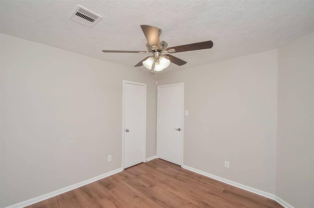 Welcome to your Primary En-Suite Bedroom. Privately located away from the other bedrooms with back yard views.