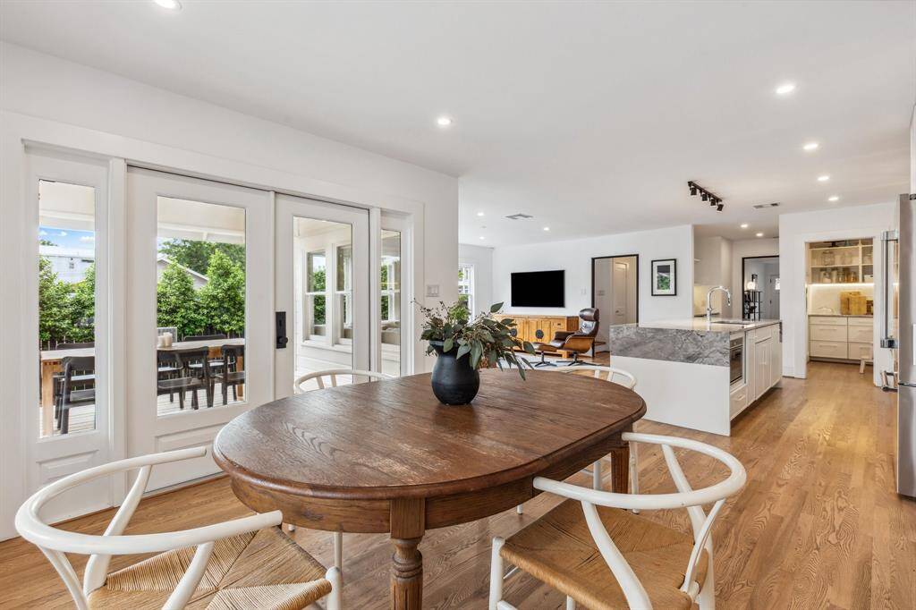 Beautiful French doors provide direct access to the covered porch and rear yard for seamless indoor-outdoor living and entertaining.