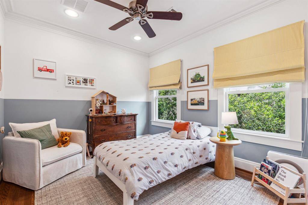 This main-level secondary suite shines with a king-size bedroom, two roomy closets, custom window blinds and an en suite bathroom.