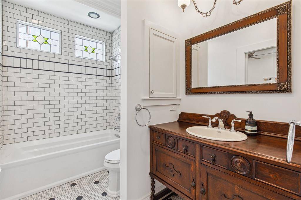 Inside, the first floor bedroom's ensuite private bathroom you'll find an extra-deep Kohler tub/shower trimmed with beautiful tile.