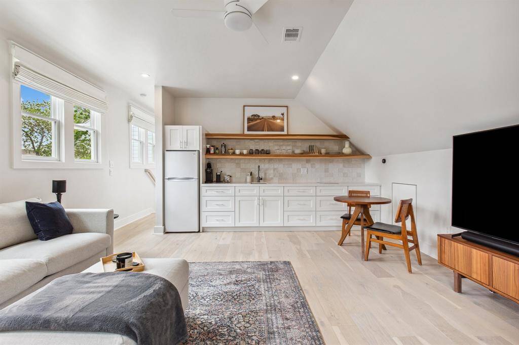 Enjoy generous wardrobe storage in the huge walk-in closet where custom cabinetry, shelves and hanging rods keep clothing and accessories beautifully organized.