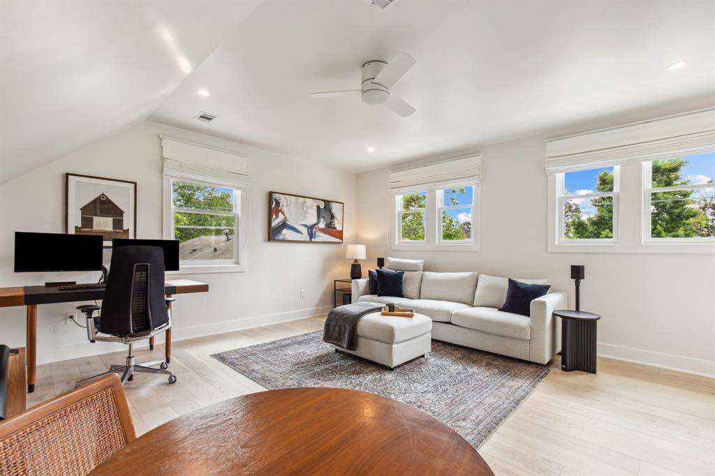 Large linen cabinets, a tiled shower stall and a private water closet complete the exceptional primary bathroom.