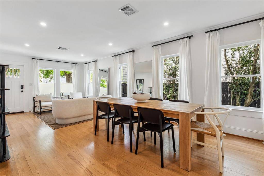A stained glass craftsman door, crown molding, original floors and original pulley-style wood windows nod to the home's 1935 origins, while a long list of contemporary updates attends to modern living.