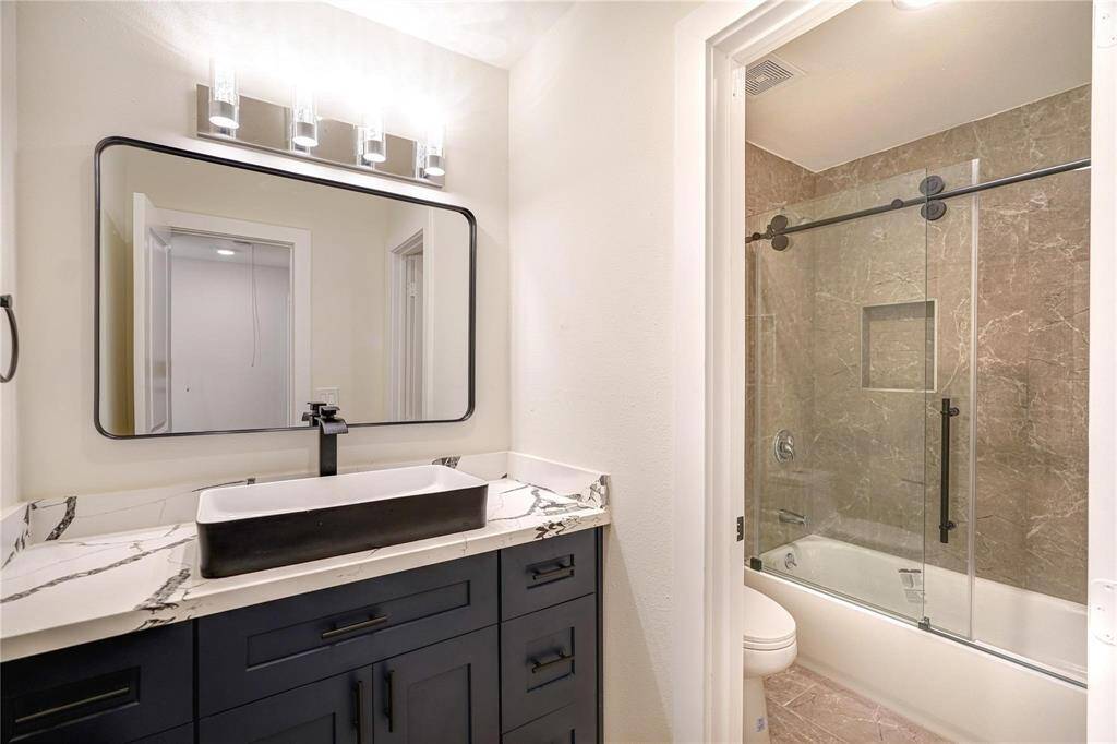 Full bath on second floor with tub.