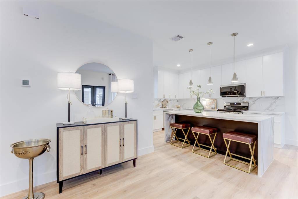 The quartz island kitchen and  pendant lighting is the perfect  place to entertain.