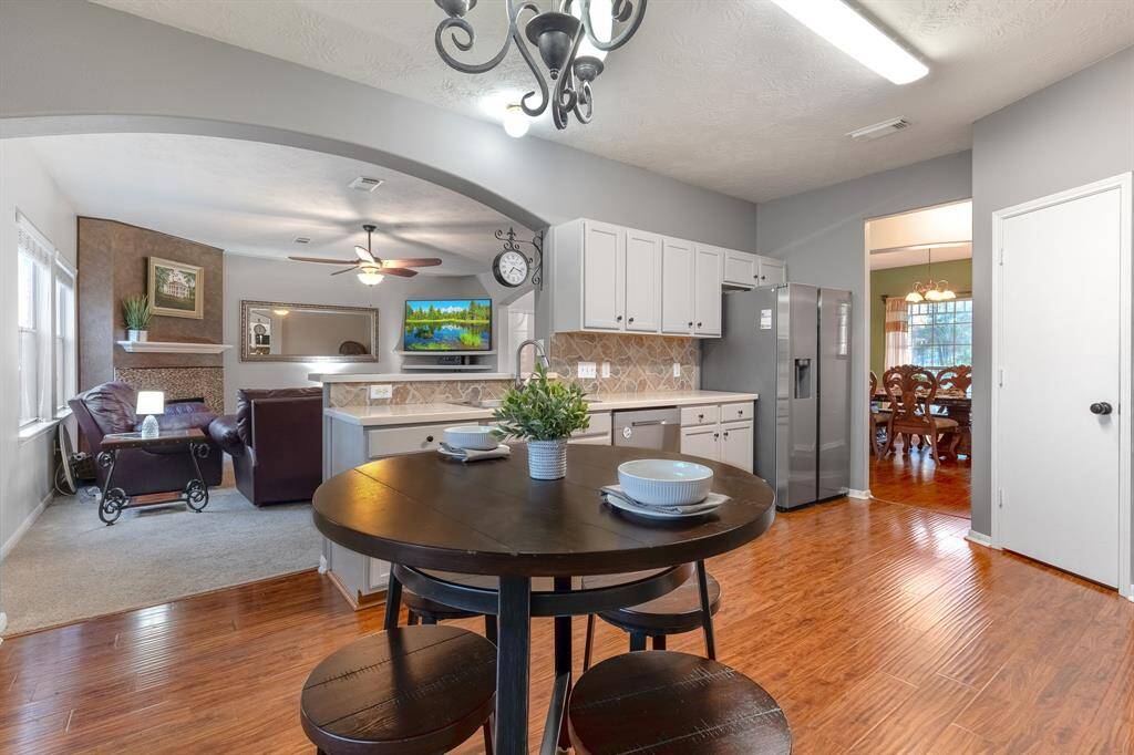 The kitchen and breakfast nook open up to the family room