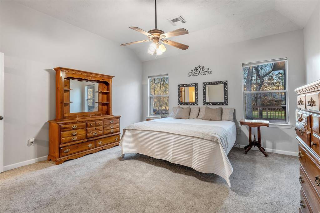 The spacious primary retreat is on the main floor