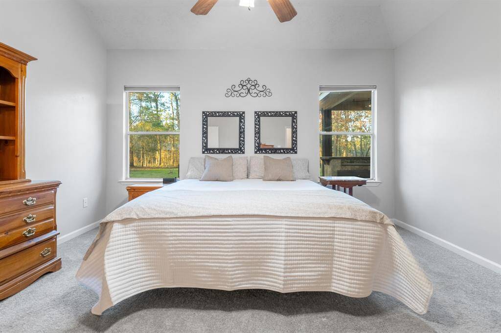 The primary bedroom overlooks the backyard