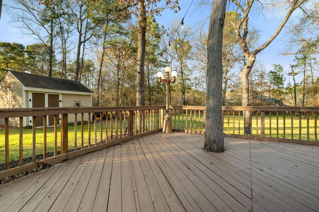 Just another angle of the expansive wood deck and storage shed