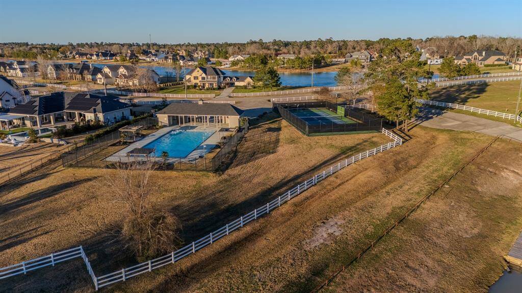 Overlooking the community pool and courts