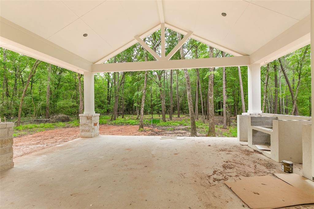 Spacious backyard with a huge, covered patio, perfect for outdoor living, entertaining or simply enjoying the fresh air.