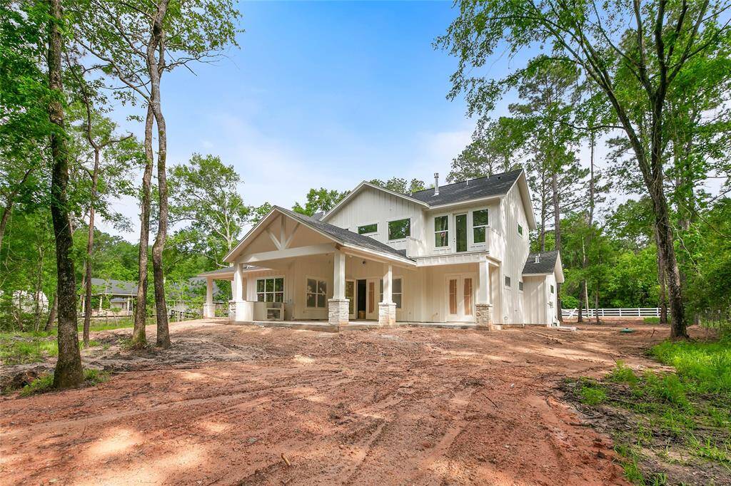 Huge vaulted back porch with outdoor kitchen for relaxation.