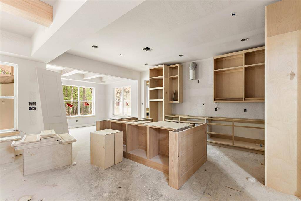Off the island kitchen is a dining area that overlooks the beautiful backyard.