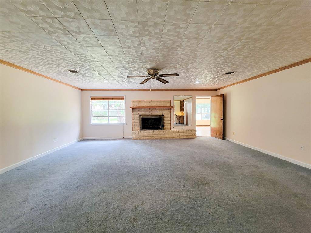 Expansive family room with wood burning fireplace.