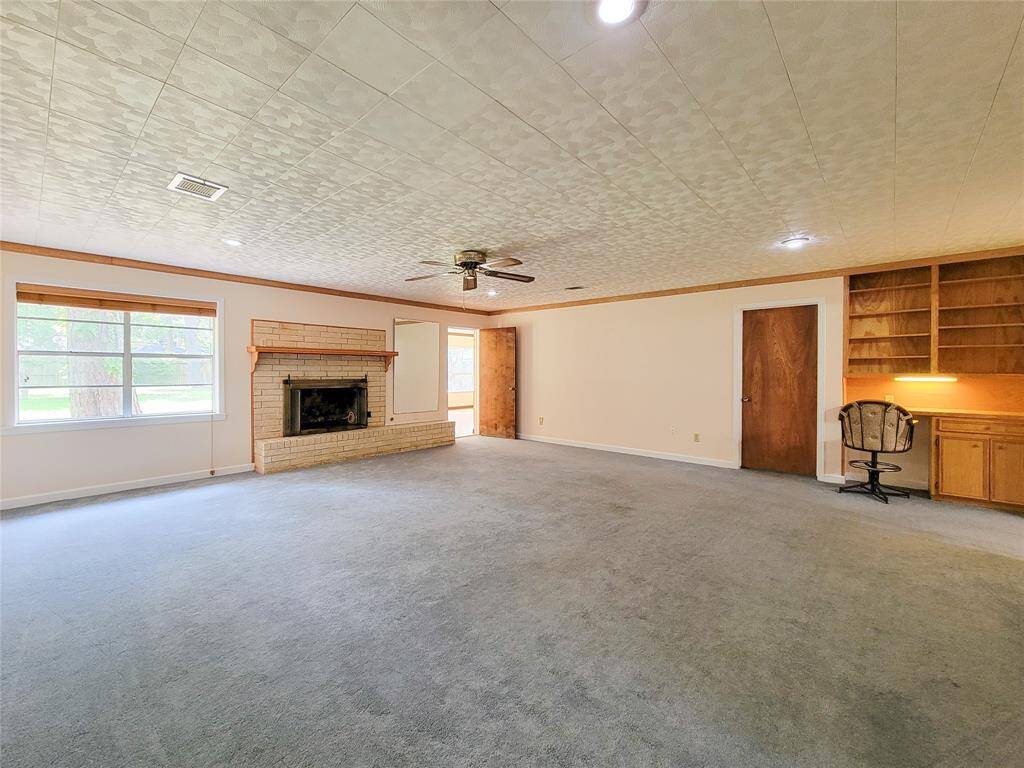 The door at the back of this vast room leads to the light filled sun room.