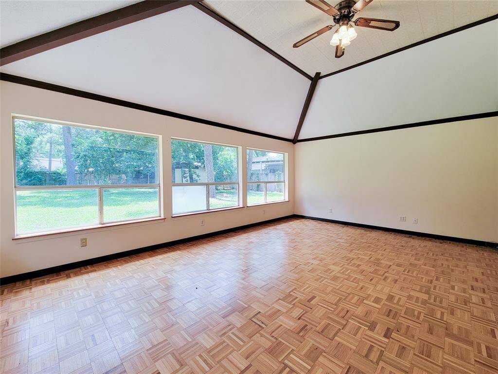 An alternate view of this large space with beautiful parquet flooring.