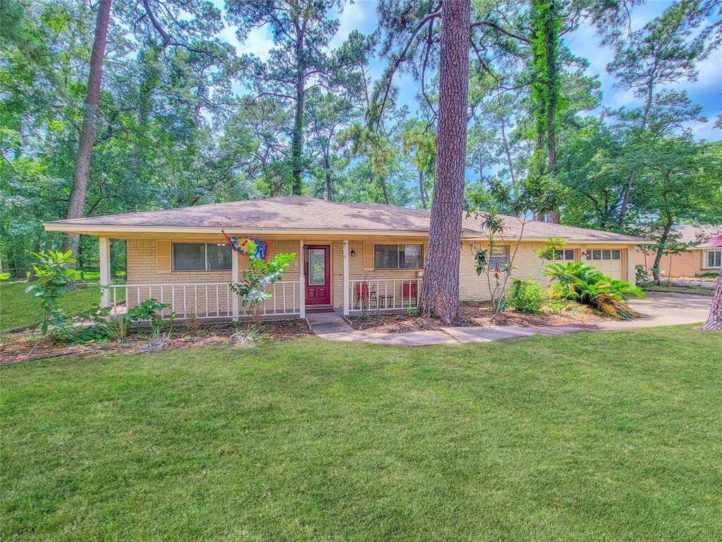 This lovely home is nestled on an expansive tree lined lot.