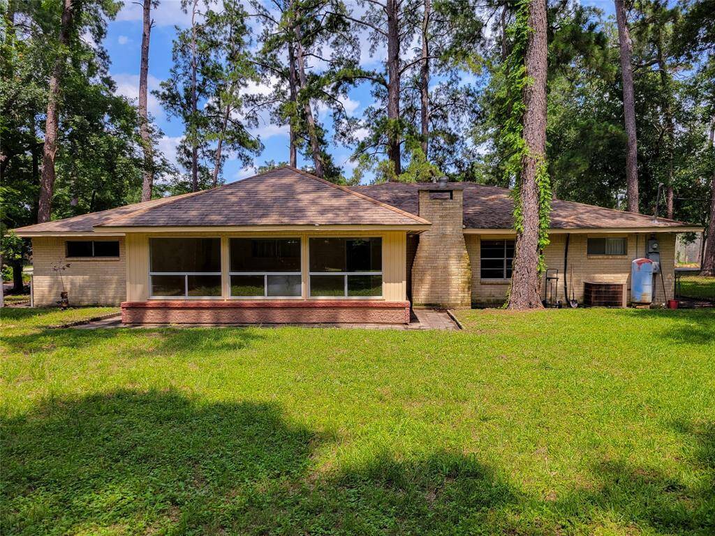 The structure has classic lines and blends into the lush landscape,