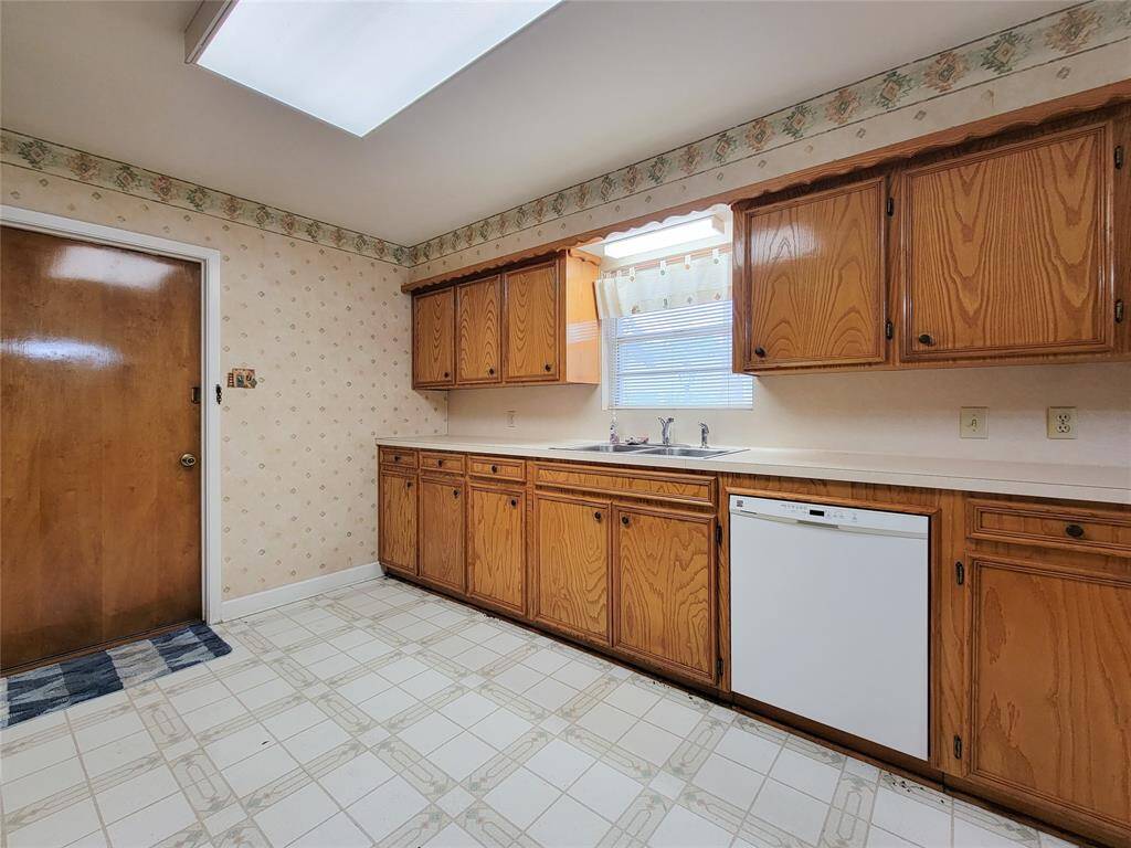 Cabinets provide storage galore in the large kitchen.