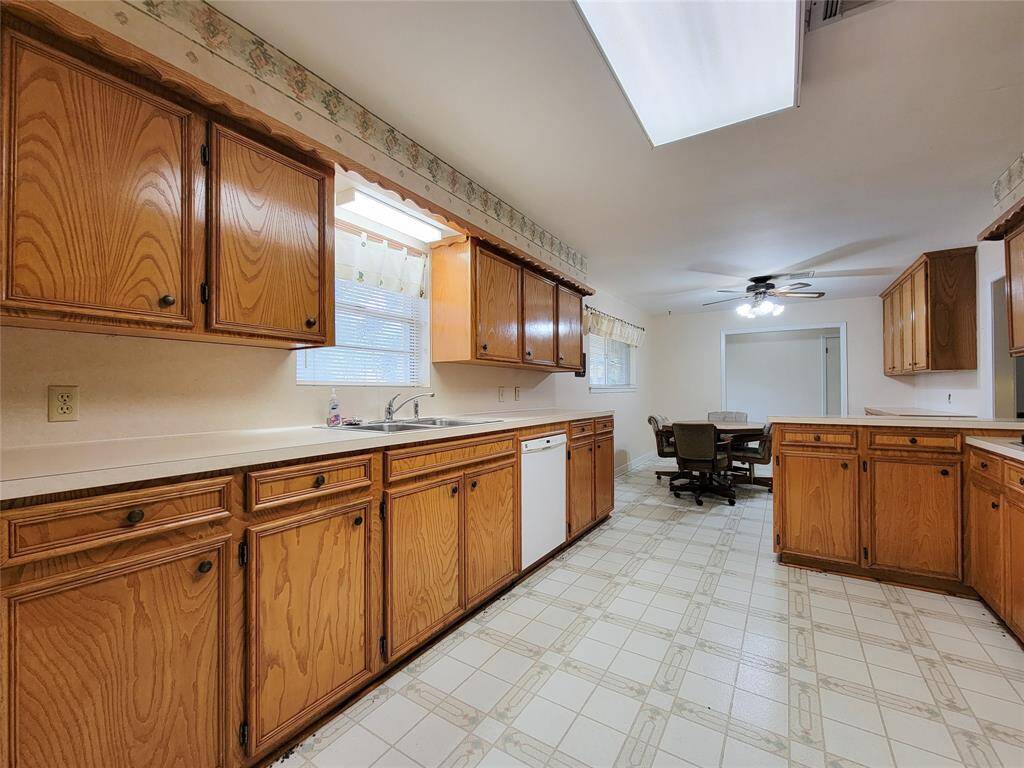 A great perspective shows off the size of the kitchen as it flows into a good sized dining area.