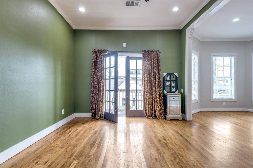 The primary bedroom with a small balcony.
