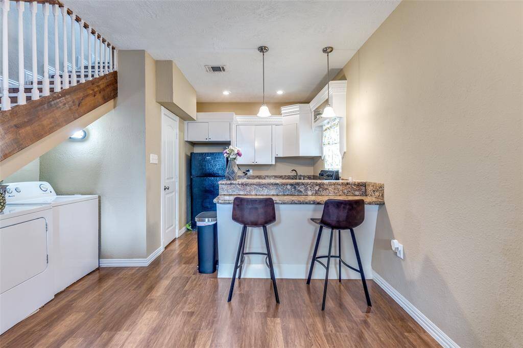 Garage apartment kitchen and laundry area.