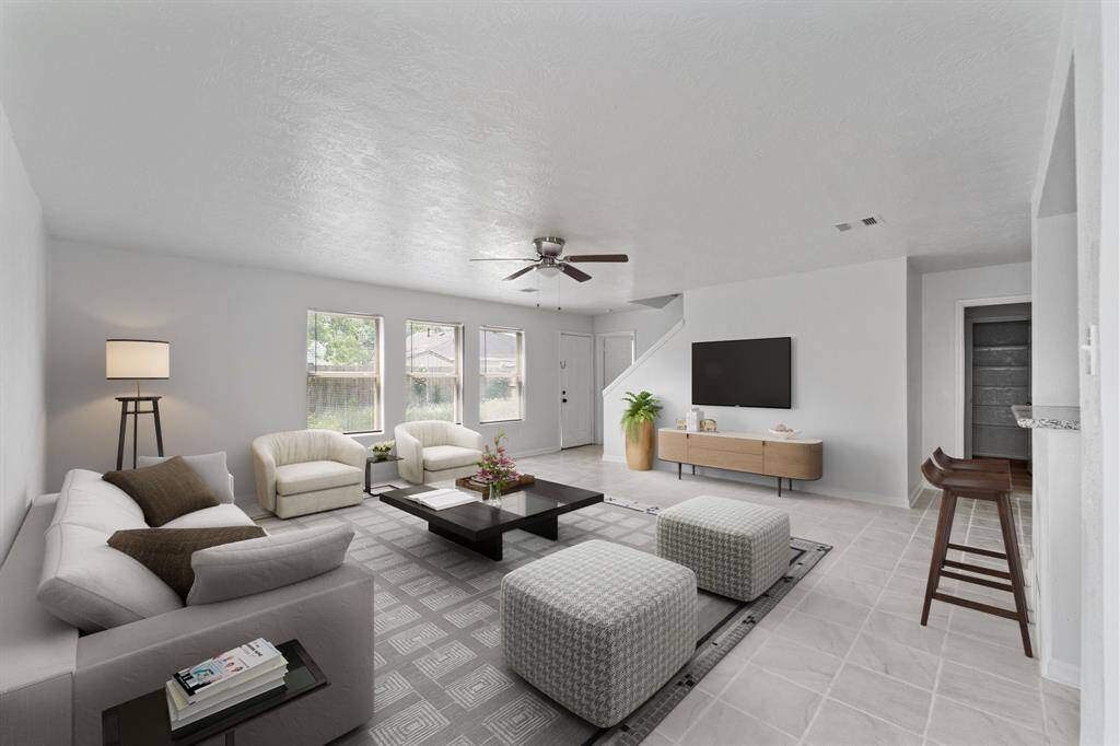Virtually Staged: This open and bright living room is spacious enough to fit the whole family.