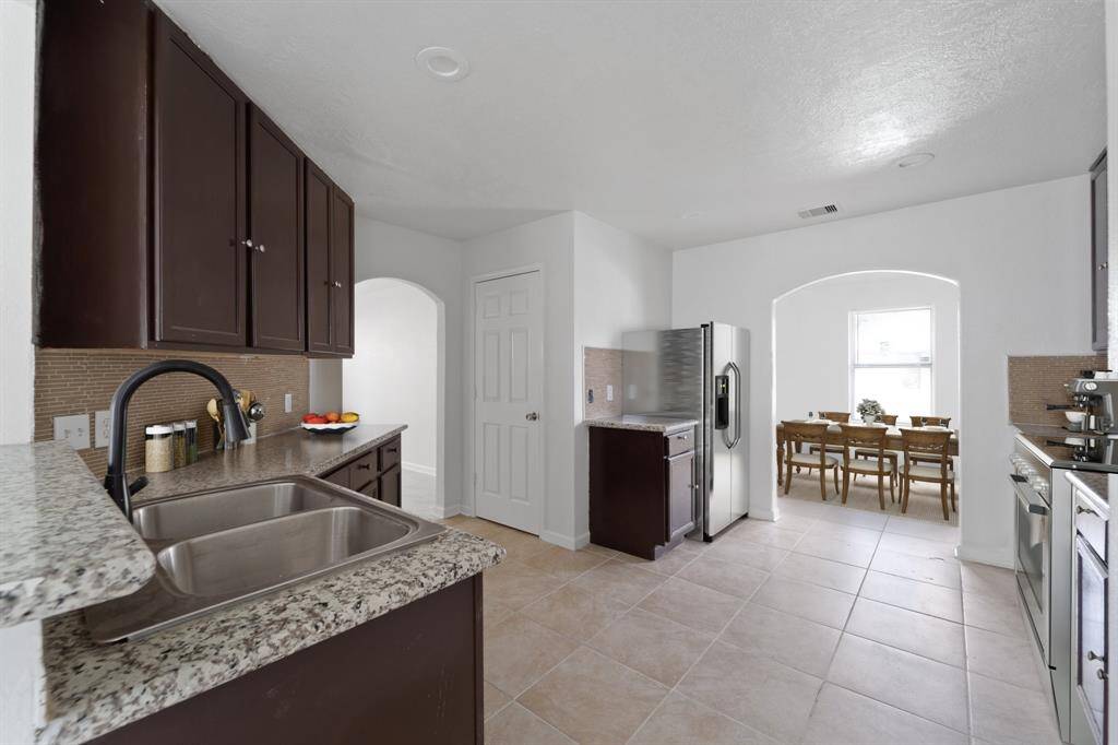 Virtually Staged: The dining and kitchen are seamlessly connected.