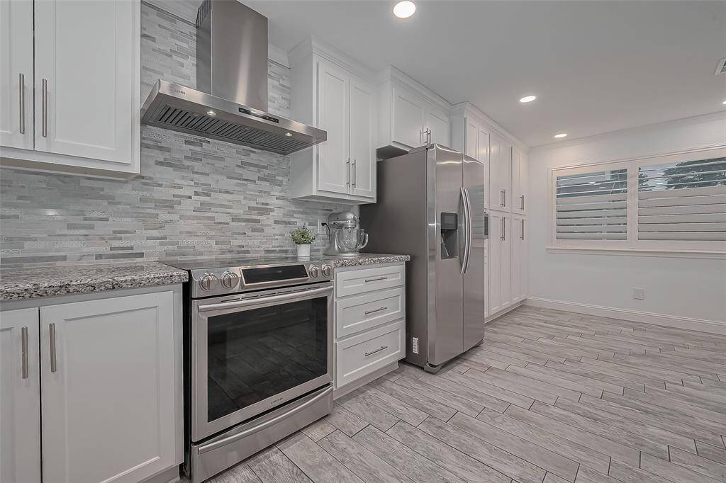 Large remodeled kitchen with built in pantry