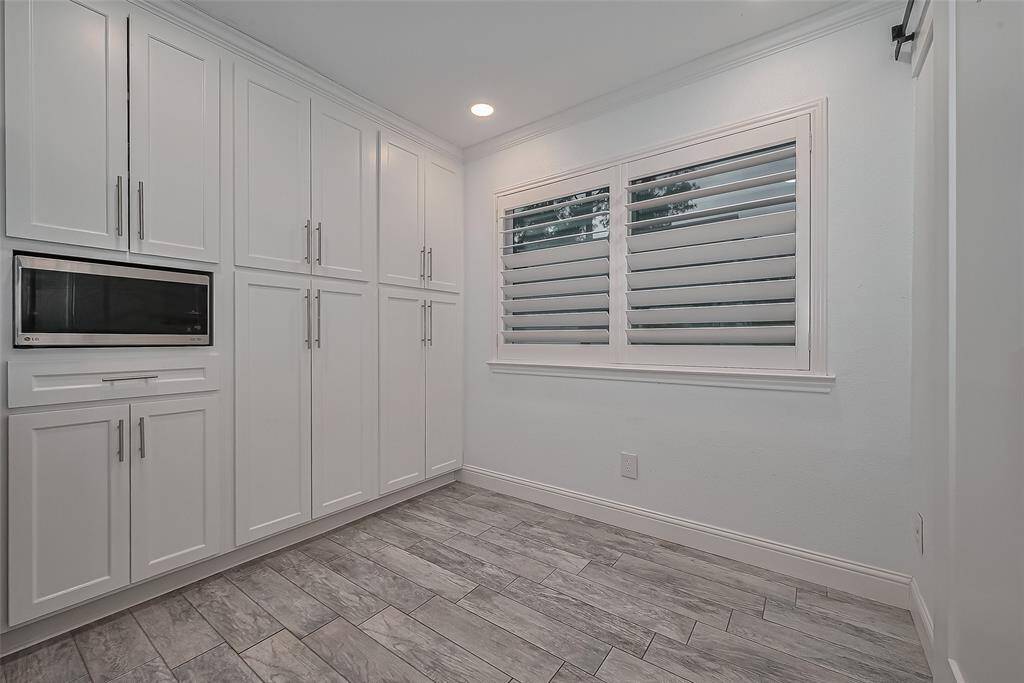 Pantry is built into the cabinets; microwave stays
