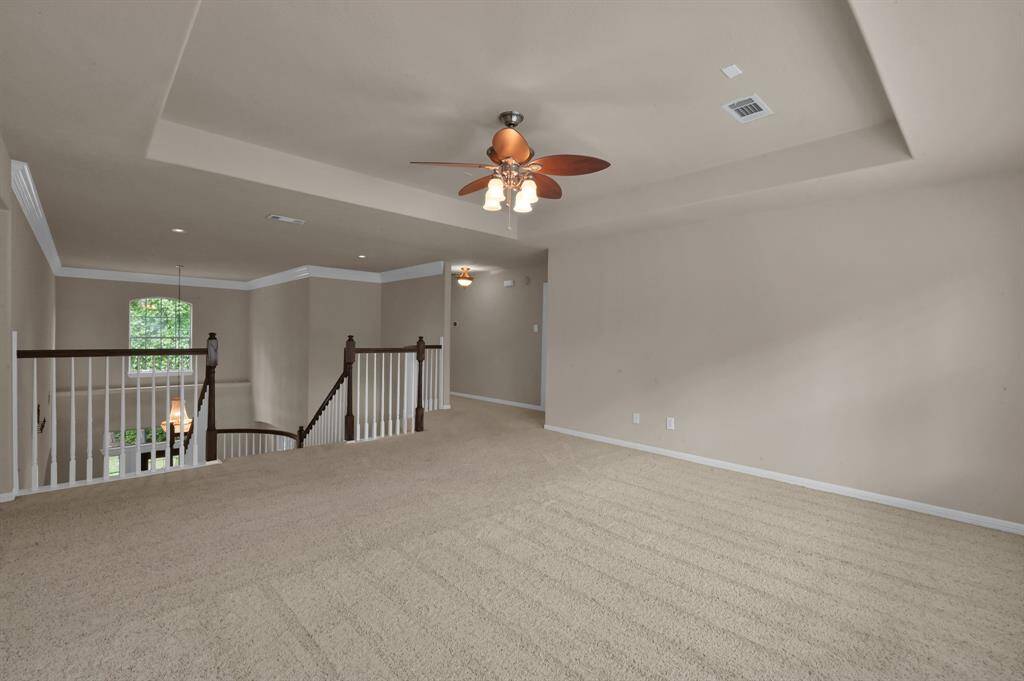As you reach the second level of this home, enter a room full of options. Enjoy watching movies, read, complete homework, use as a playroom or many other things.