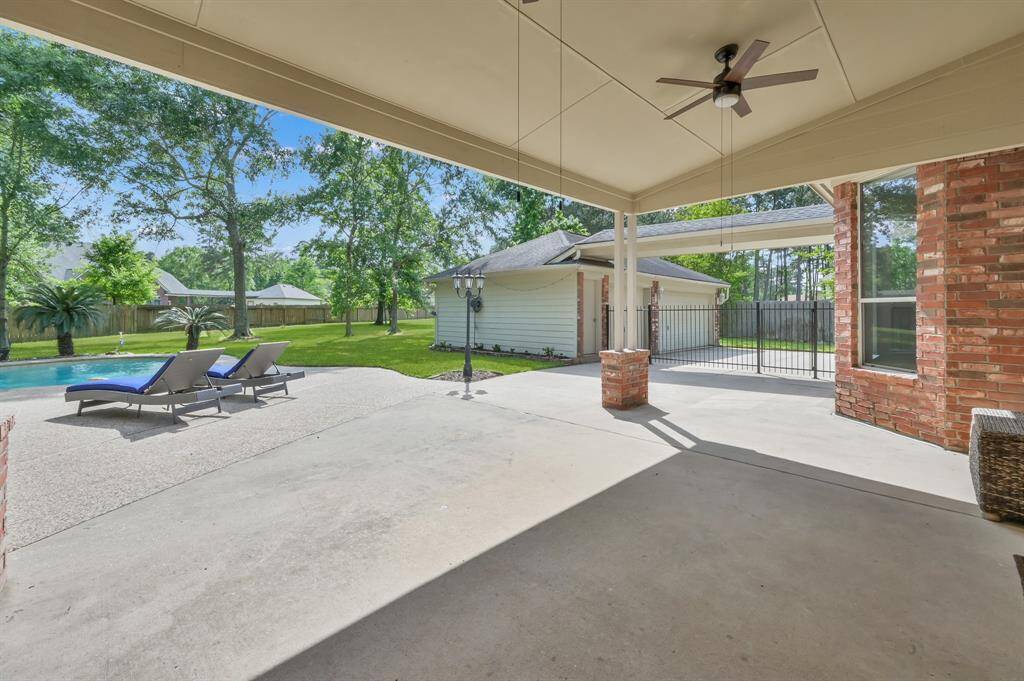 Rain or shine, you will enjoy entertaining under the expansive covered patio. Enter this space from the French doors off the living room or from the side gate off the driveway. Two fans with lights will keep you cool on warmer days. There is plenty of room for a dining table and more seating to relax while you look out to the sparkling pool and spa.