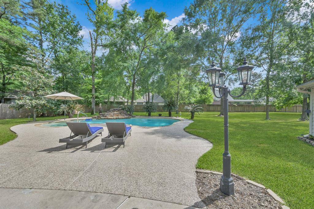 Spend many fun days staying cool in your secluded and personal pool and connected spa. The waterfall feature creates calming sounds while you are in or out of the pool. There is also an umbrella holder for needed shade while swimming. Additional decking around the pool provides space for sunbathing and more room for you and your guests when entertaining. There is room for chaise loungers or other additional seating.
