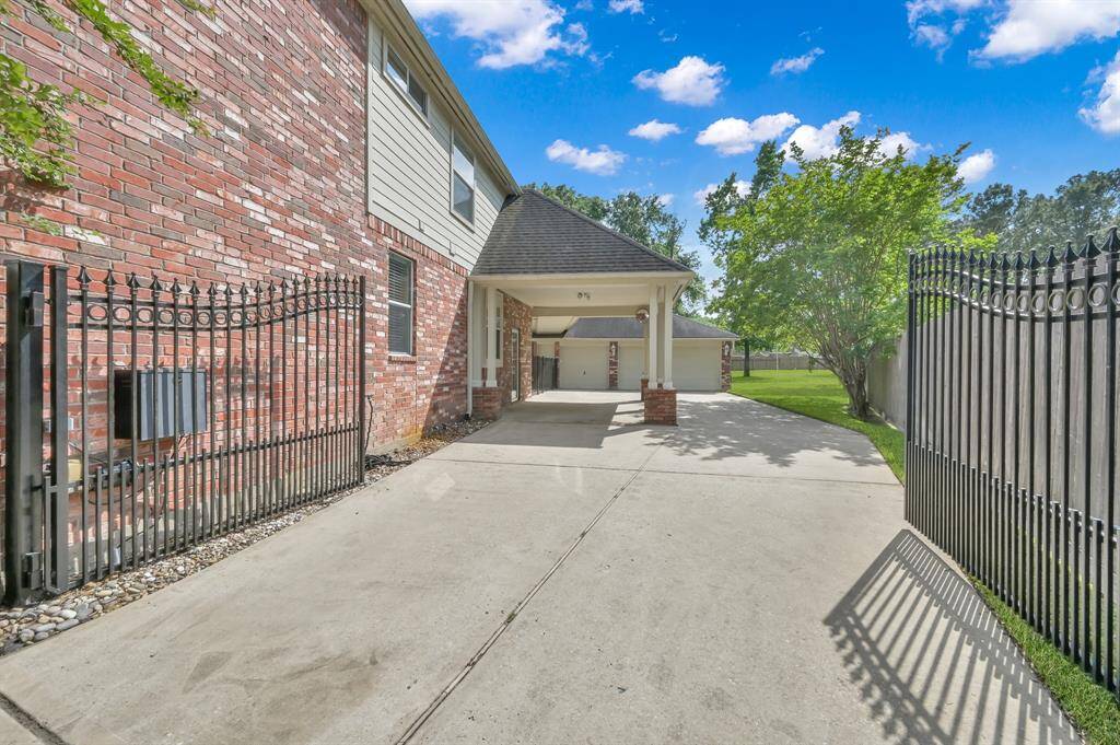 An electric gate with remote or touch pad for manual entry provides an extra way to protect kids, pets and cars with a boundary to the street. A side entry door allows easy access from the driveway, or the three-car detached garage. In addition to the electric gate, the entire property is fenced.
