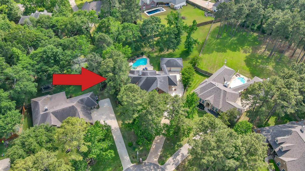 A great view of this wooded cul-de-sac lot. Imagine enjoying a refreshing soak in your very own private sparkling pool!