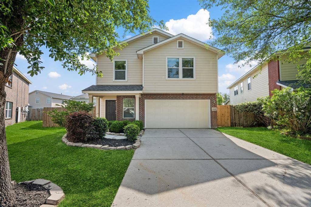 Two-story home on quiet cul-de-sac with welcoming curb appeal.