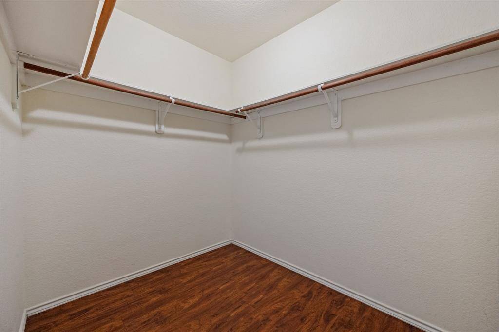 Walk-in closet with ample storage space.