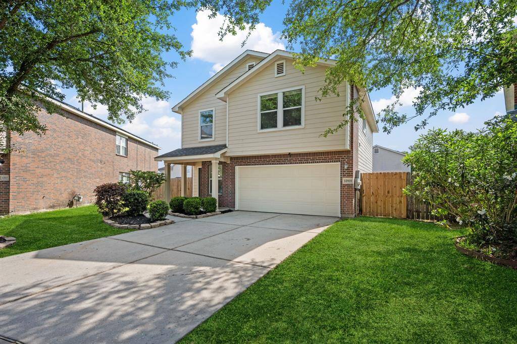 Driveway and garage view from the front of the home.