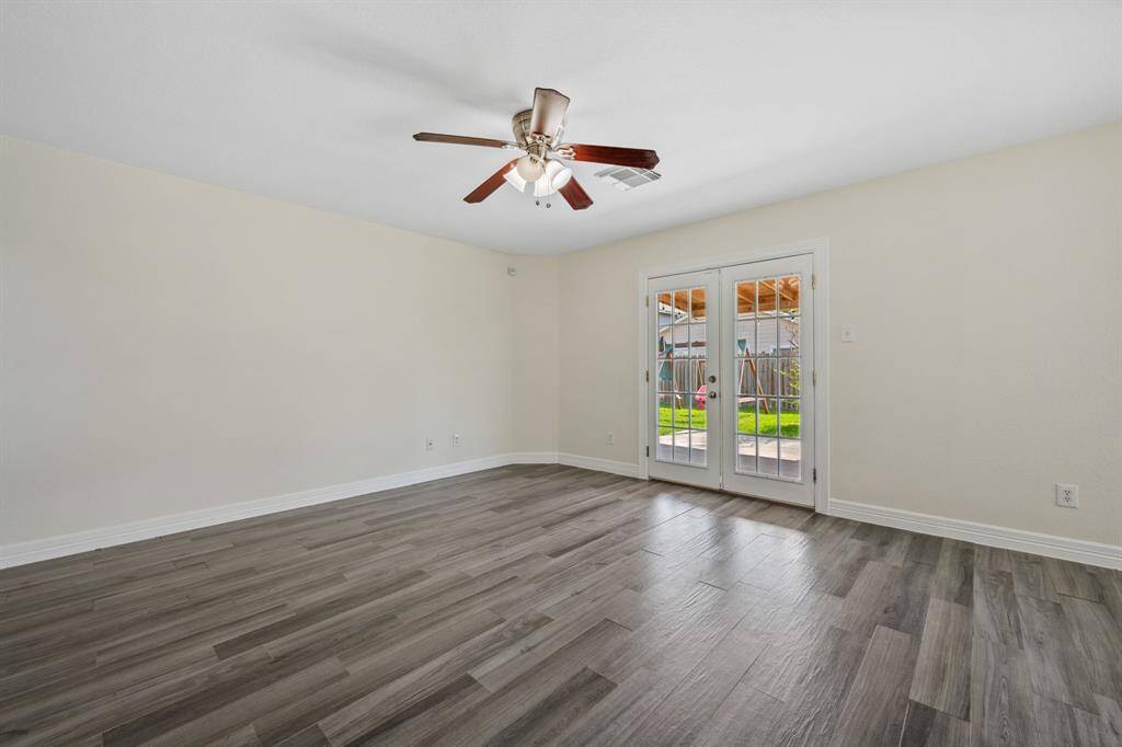Dining area off the kitchen with natural light and updated floors.