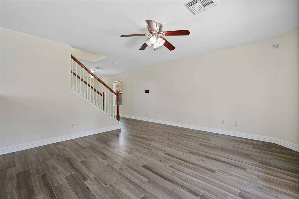 Living area with tile flooring and space to gather or unwind.